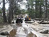 033. Miren and Larry cross a small run-off creek..jpg