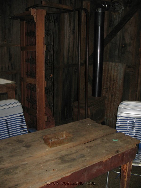 07. Inside there's a table and some lawn chairs..jpg
